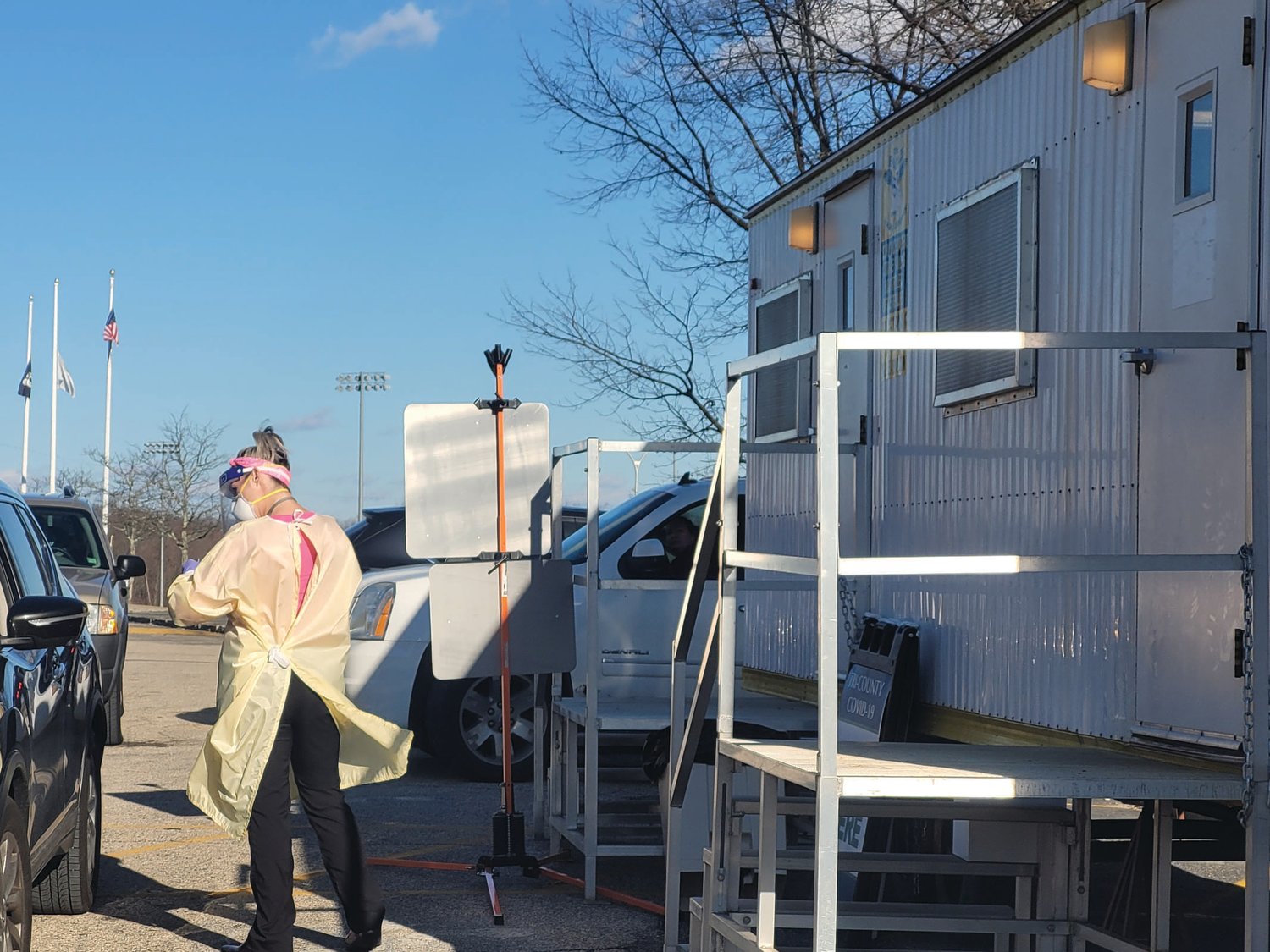 TEST OF PATIENCE: Jessica Gormley, Practice Manager for Tri-County Community
Action Agency, helped test for COVID-19 from the free testing trailer stationed
in the Johnston High Parking lot.